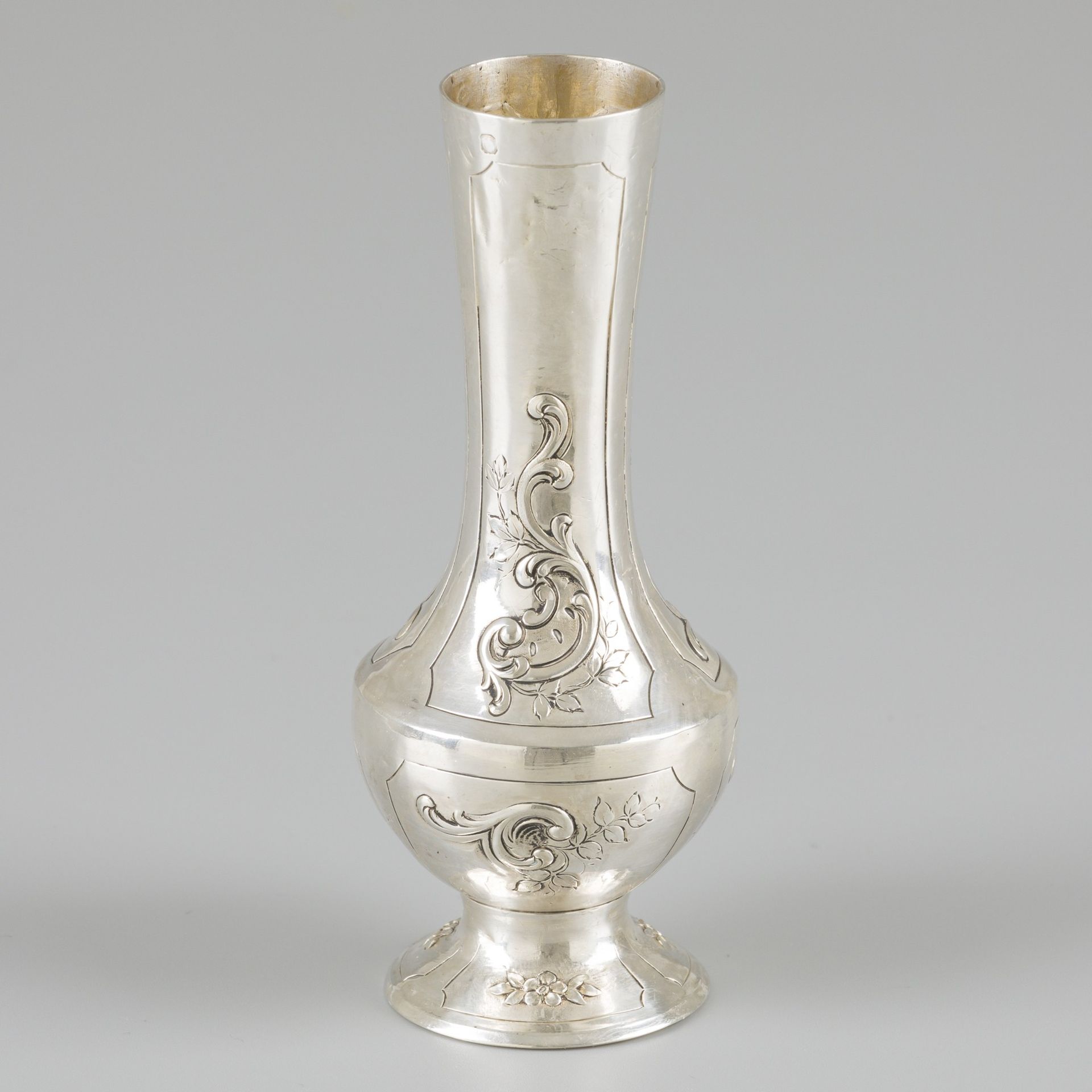Flower vase silver. With repoussé rocailles and floral decorations, standing on &hellip;