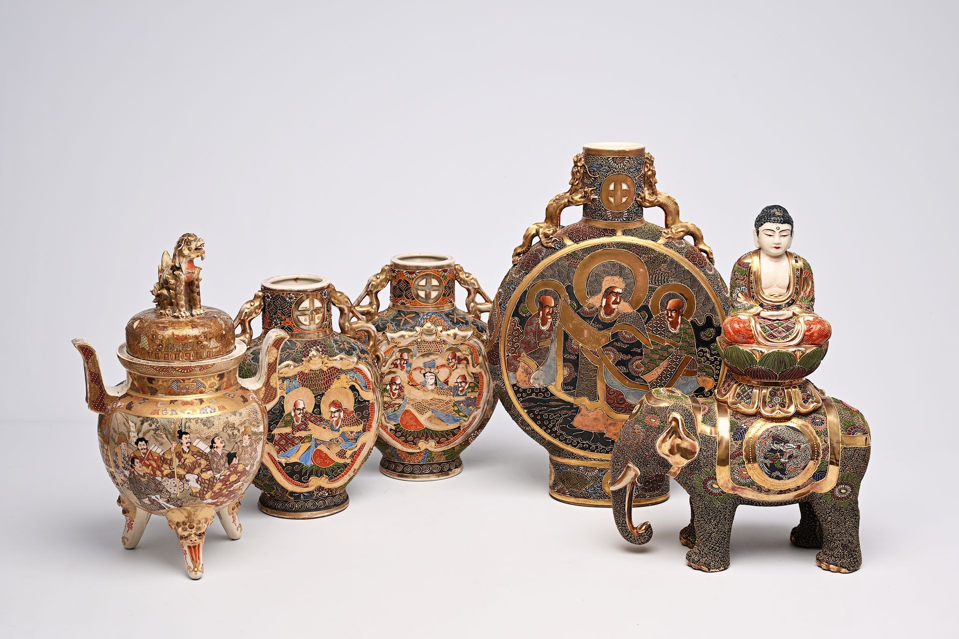 Three Japanese Satsuma 'moonflask' vases, a 'koro' incense burner and a Buddha o&hellip;