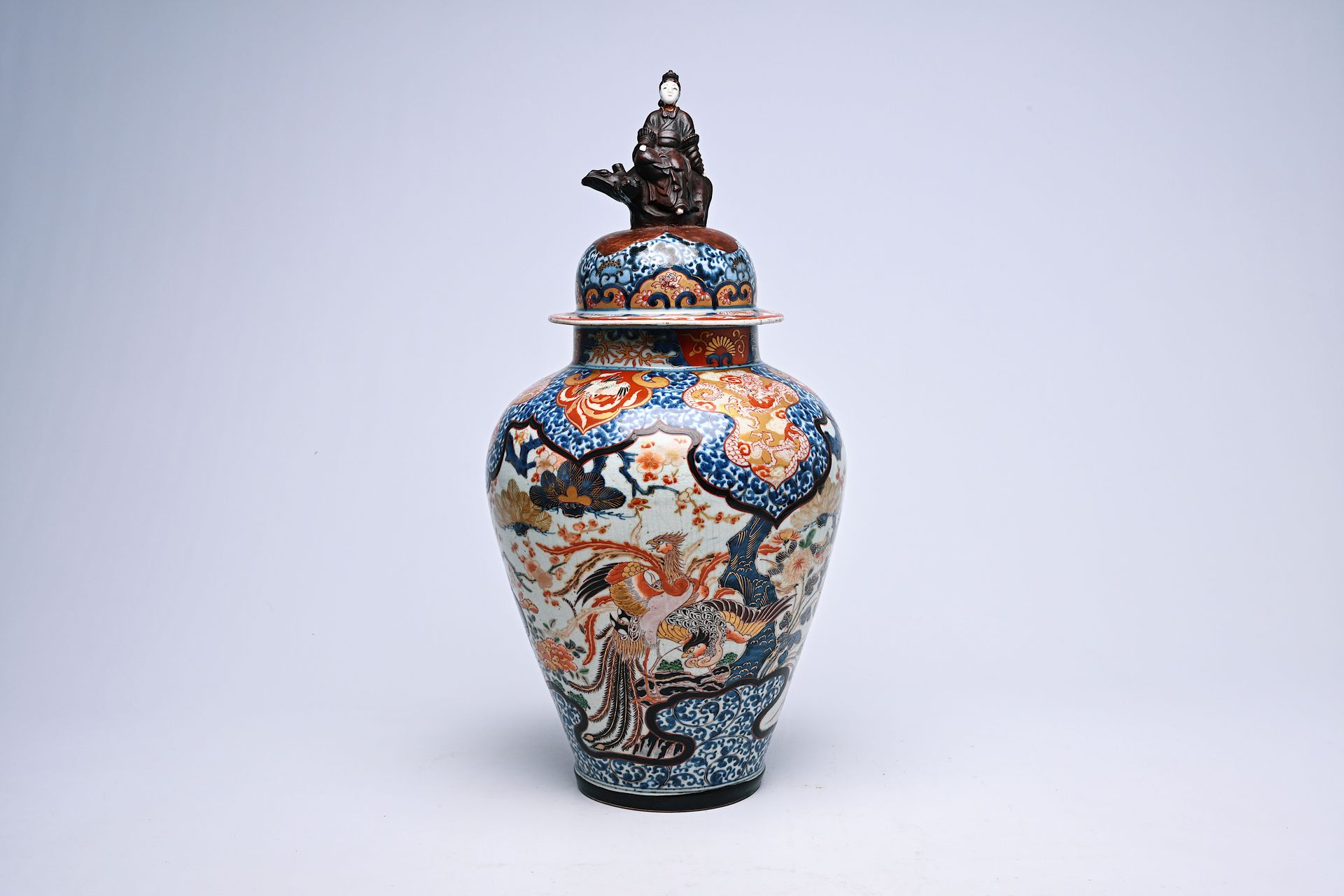 A Japanese Imari vase and cover with birds among blossoming branches and crowned&hellip;