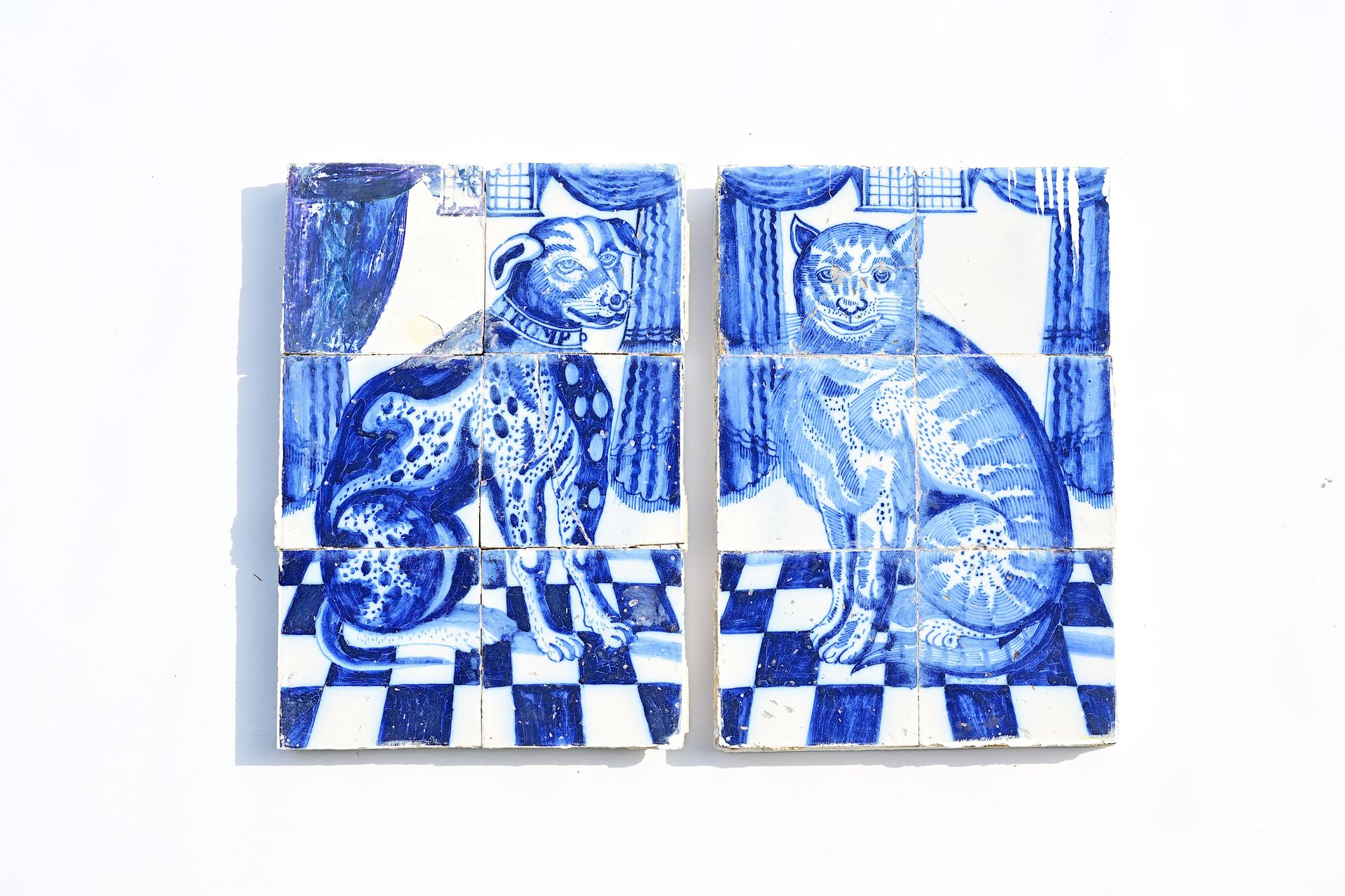 A pair of Dutch Delft blue and white tile murals with a cat and a dog ('Tromp'),&hellip;
