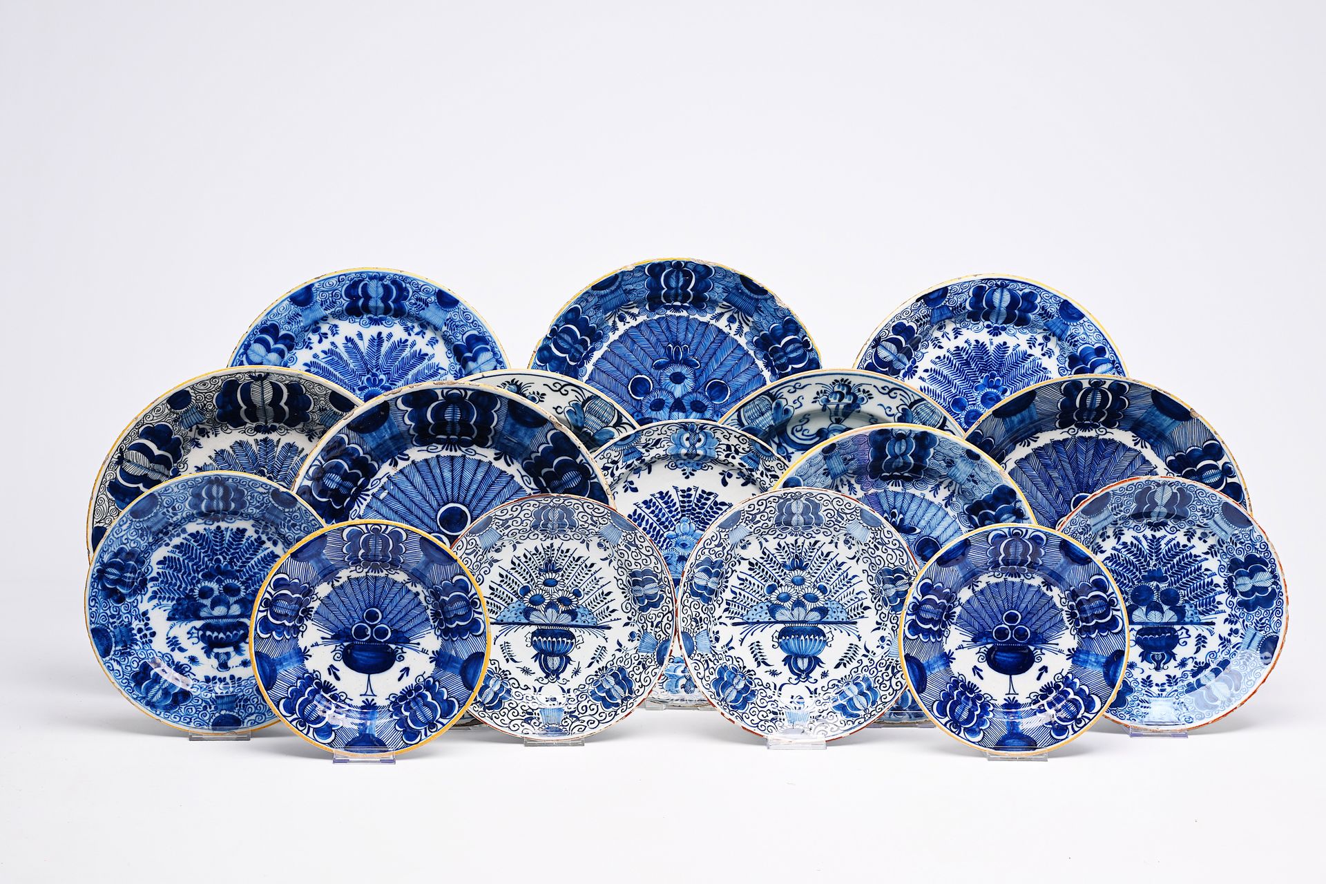 Sixteen Dutch Delft blue and white 'peacock tail' plates and dishes, 18th C. Sec&hellip;