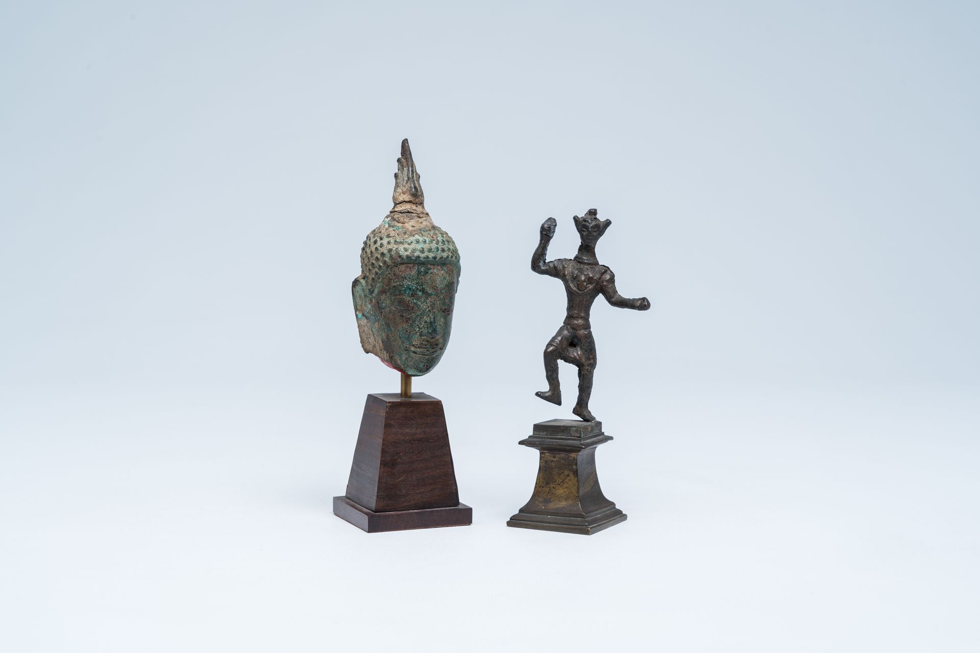 A bronze head of Buddha and a sculpture of a ritual dancer, Southeast Asia, 13th&hellip;