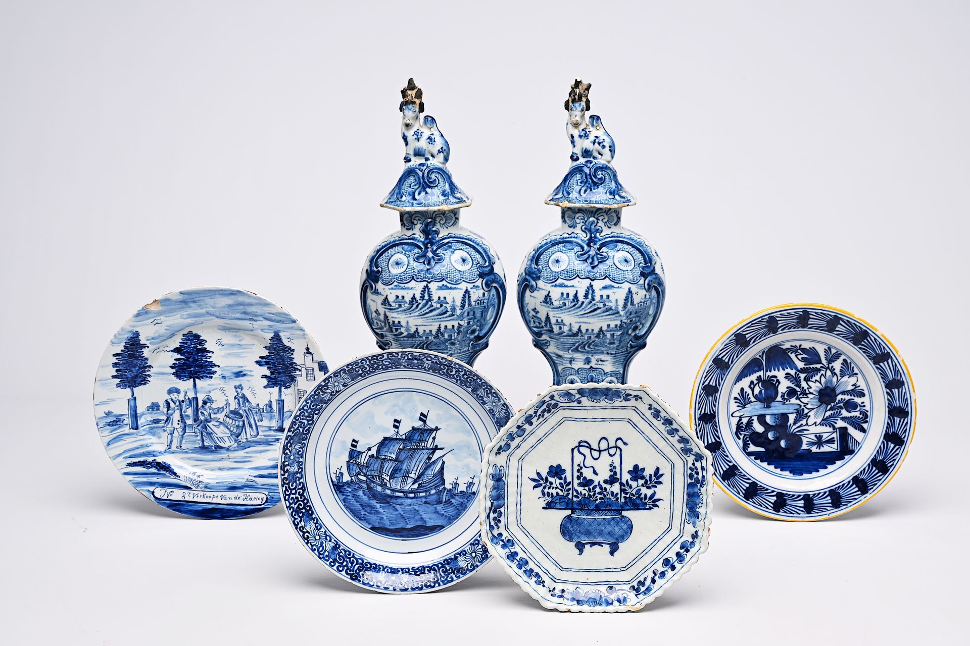 A pair of Dutch Delft blue and white vases and covers with landscapes and four v&hellip;