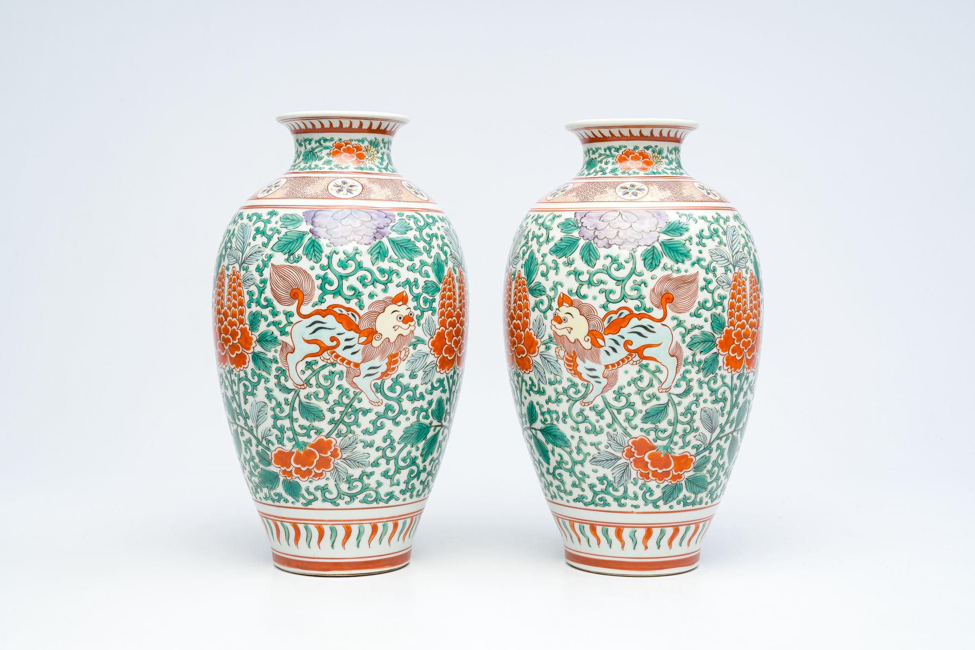 A pair of Japanese wucai style 'peony and Buddhist lions' vases, Meiji, ca. 1900&hellip;