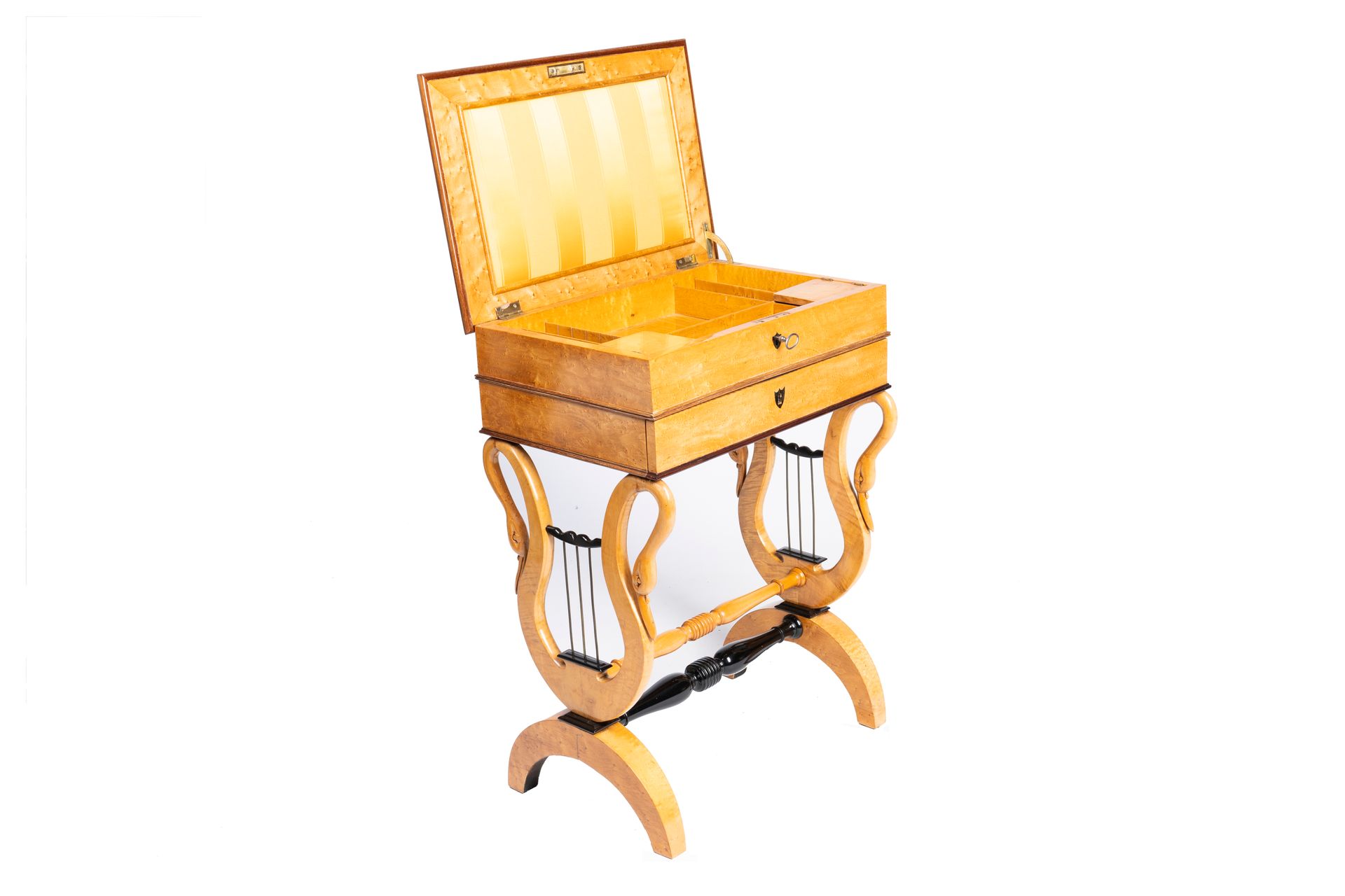 A burl wood veneered Biedermeier sewing table with lyre-shaped sides, 19th/20th &hellip;
