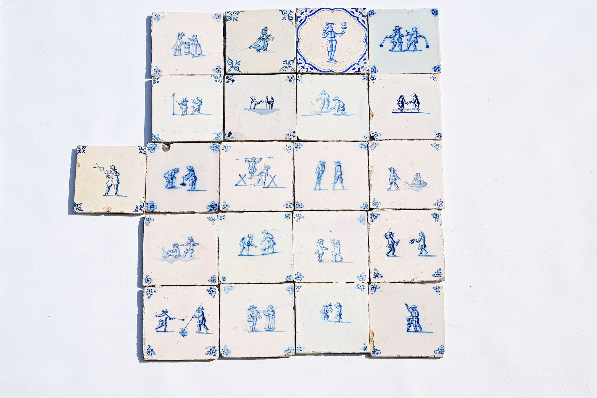 Twenty-one Dutch Delft blue and white 'children's games' tiles, 17th/18th C. Vin&hellip;