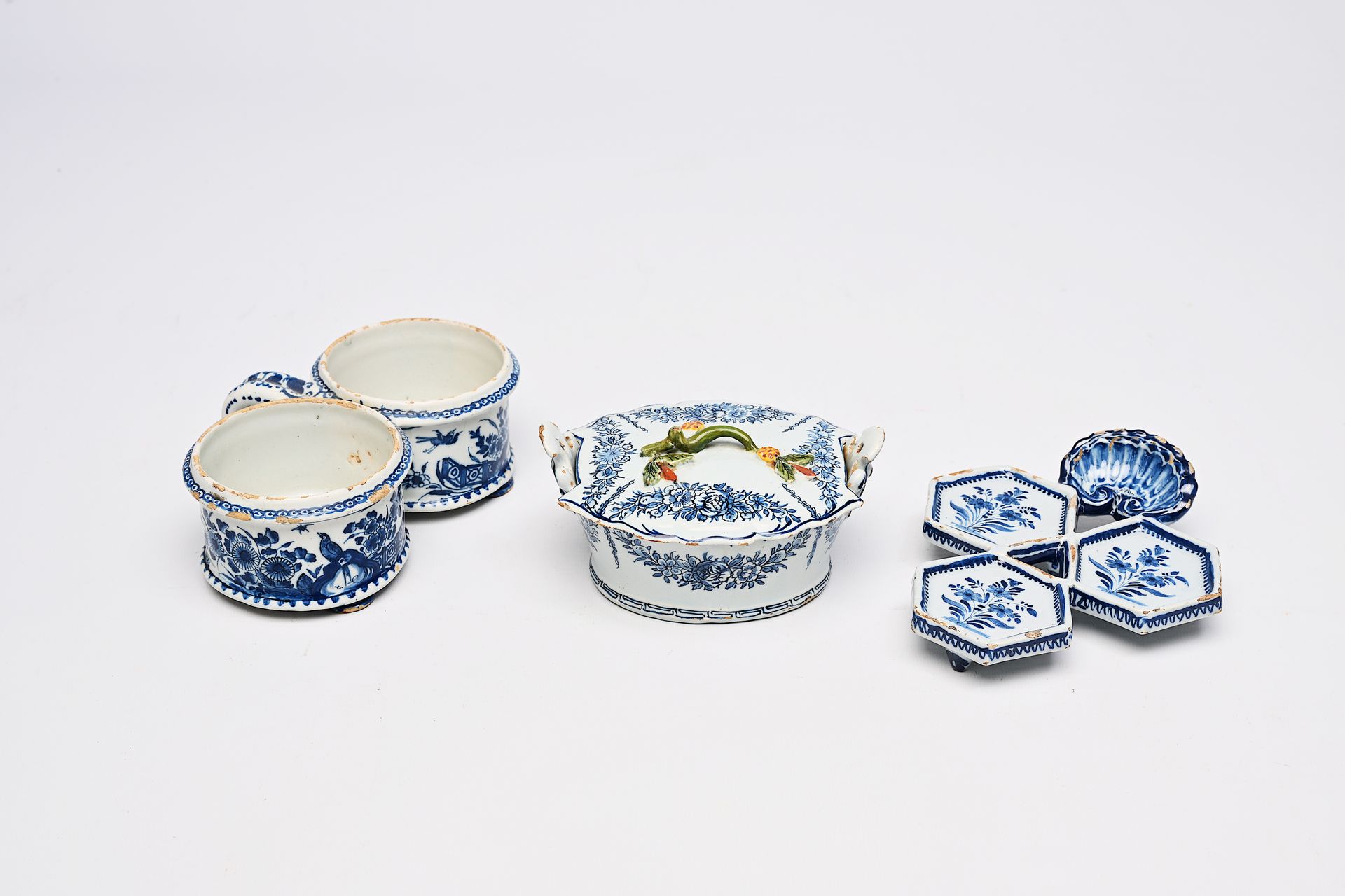 A Dutch Delft blue and white butter tub, an oil and vinegar holder and a spice d&hellip;