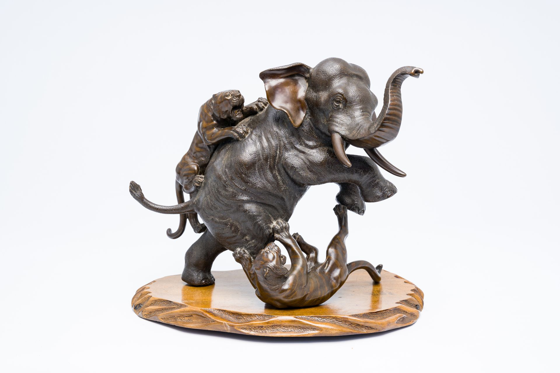 A Japanese bronze okimono of an elephant fighting two tigers, Meiji/Showa, 20th &hellip;