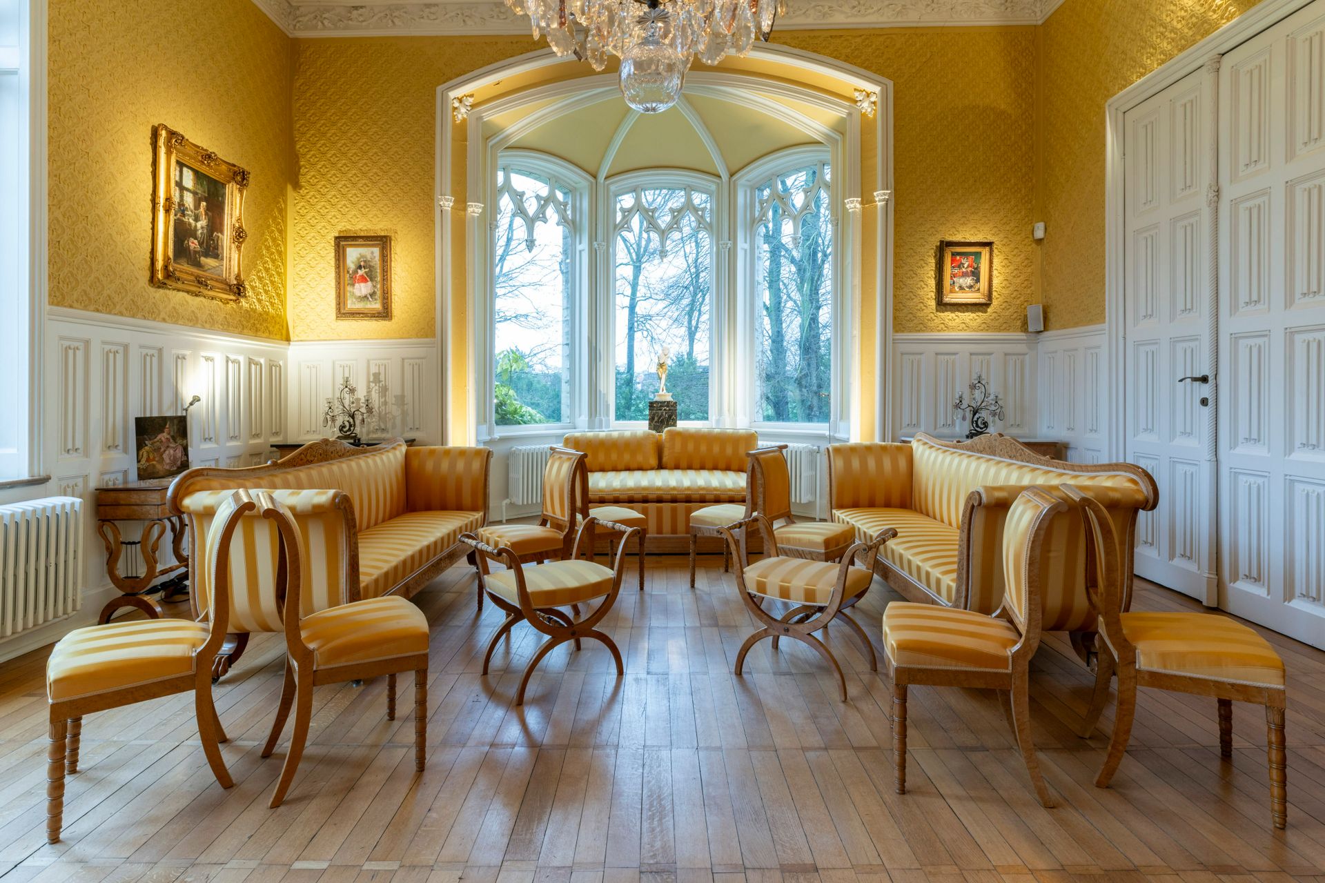 A 13-piece Biedermeier salon set comprising 3 sofas, 8 chairs and 2 footstools w&hellip;