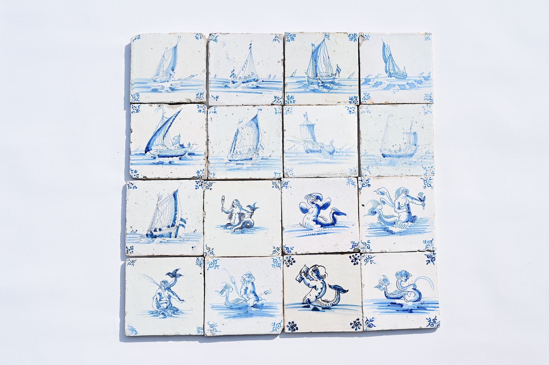 Sixteen Dutch Delft blue and white 'sea monster' and 'boat' tiles, 17th C. Seize&hellip;