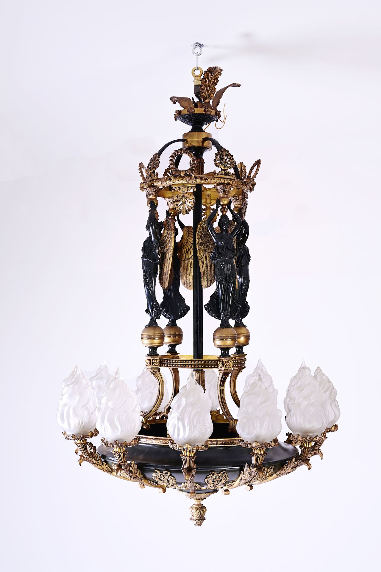 A French patinated and gilt bronze Empire style twelve-light 'caryatids' chandel&hellip;