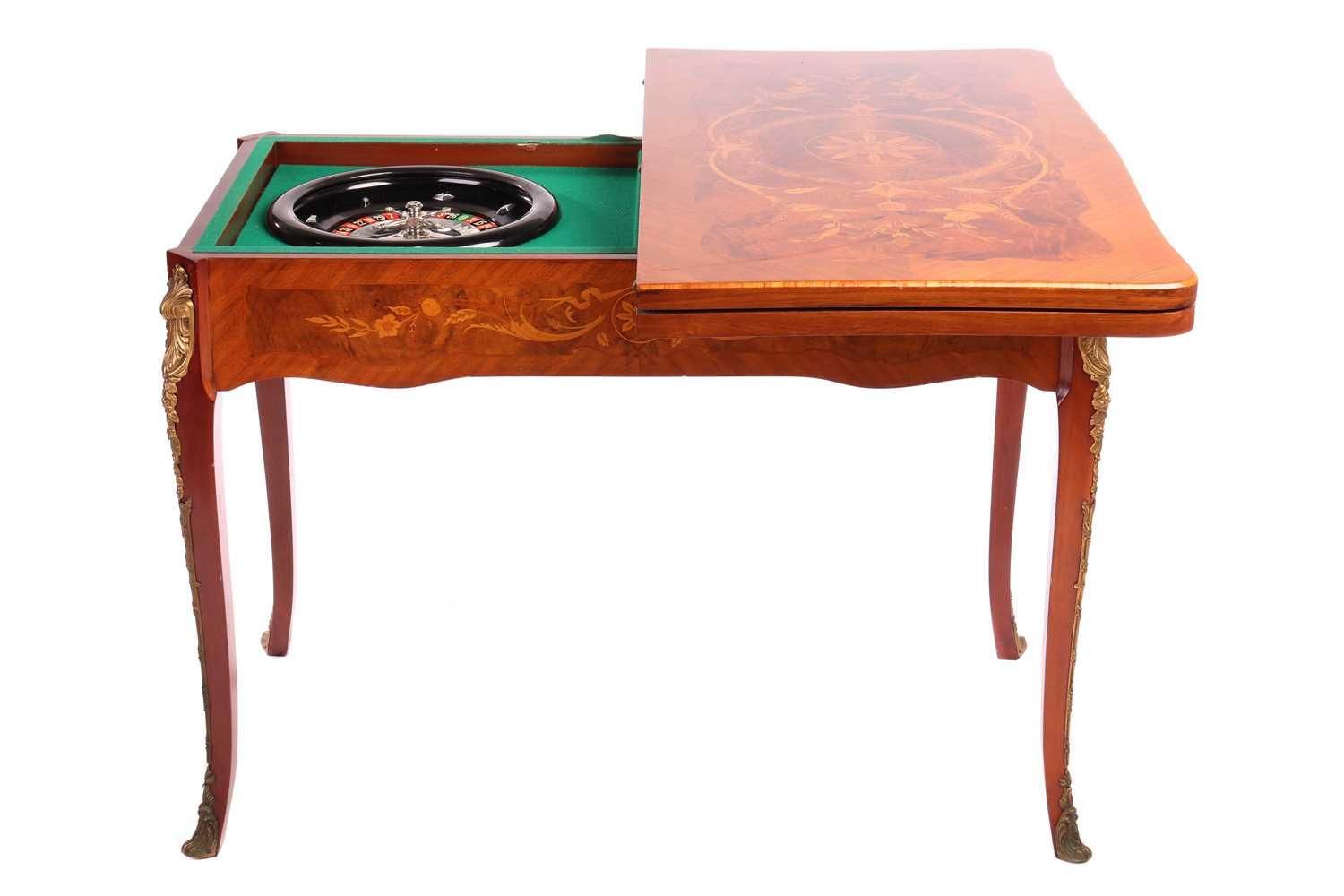 Null An Italian Dal Negro walnut and marquetry gaming/roulette table, and gaming&hellip;