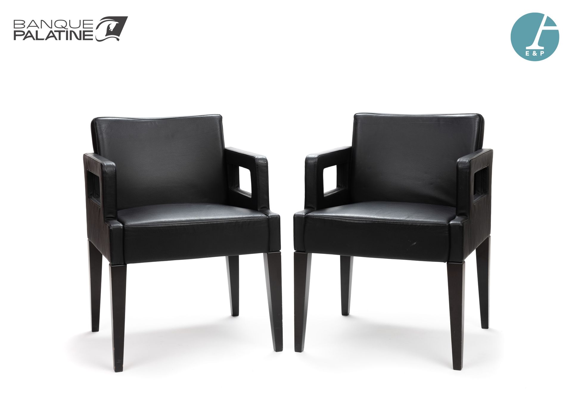 Null Pair of wooden armchairs covered with black leather, wooden tapered legs.

&hellip;