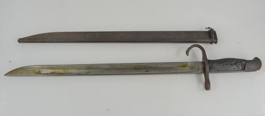Null An early 20th century military bayonet and scabbard