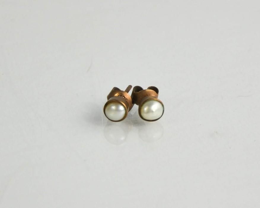 Null A pair of 9ct gold and pearl earrings.
