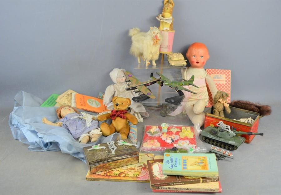 Null A group of vintage toys and books to include Dinky, Beatrix Potter stick pu&hellip;