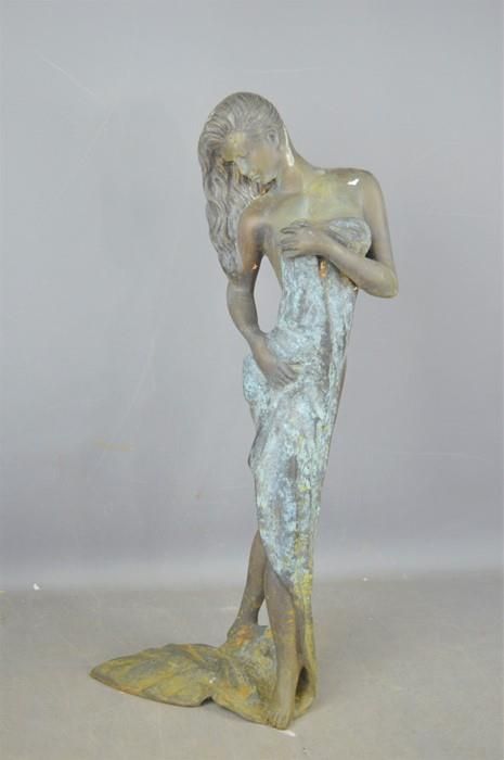 Null A metal sculpture of a partially nude lady with towel, 63.5cm high