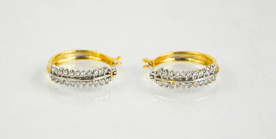 Null An 18ct yellow gold, diamond hoop earrings, 0.5cts approximately, 5.4g.
