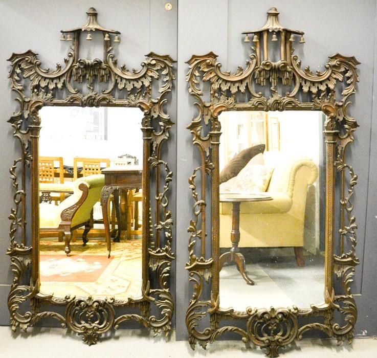 Null A pair of wall mirrors, open carved with rococo scrollwork and having Chino&hellip;