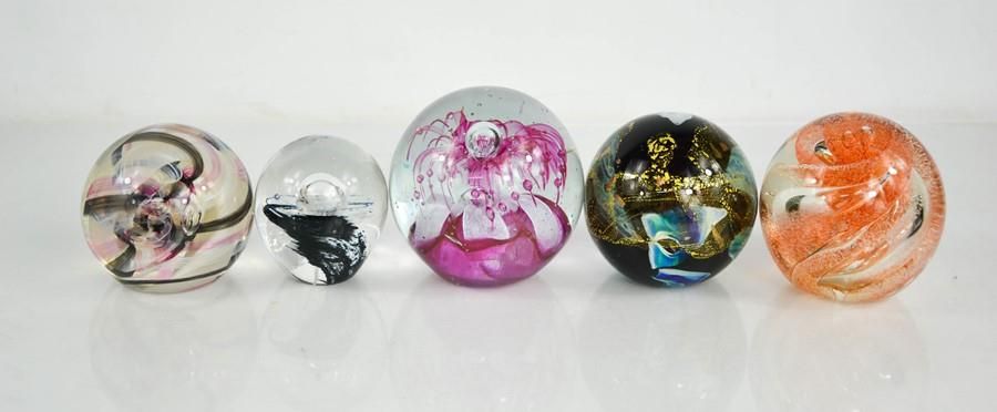 Null Five glass paperweights of various design, including Caithness examples.