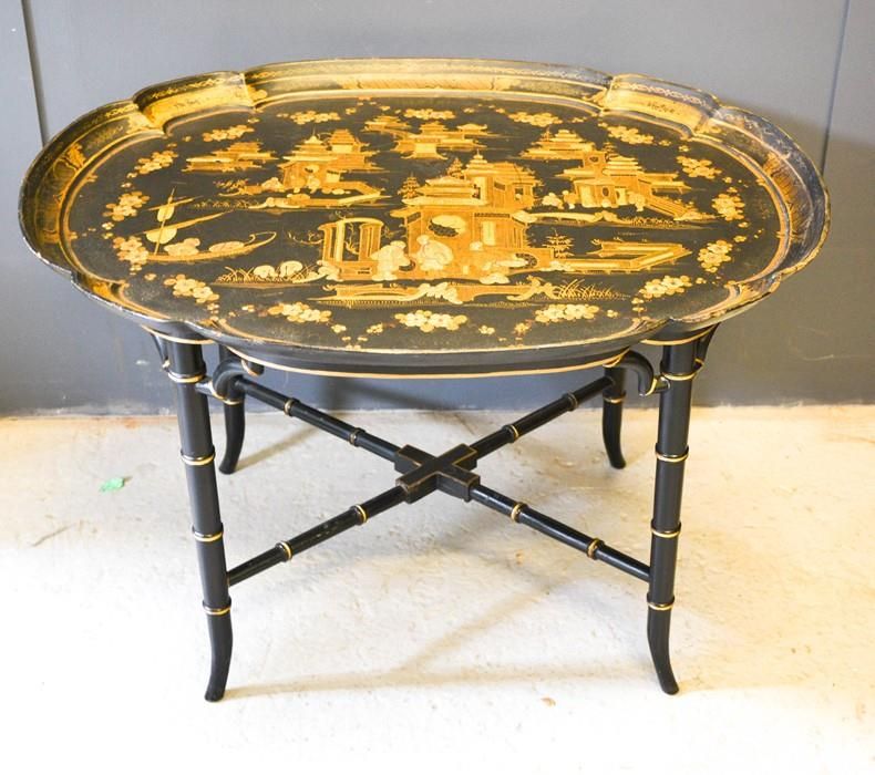 Null A Chinoiserie black lacquered table, the top of oval form decorated with fi&hellip;
