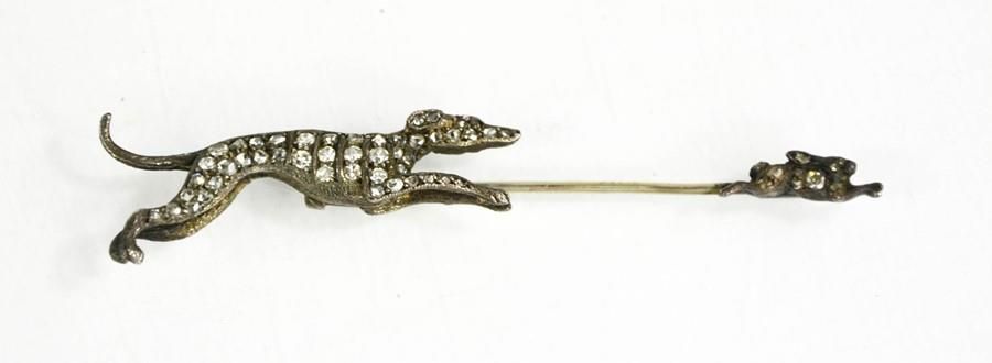 Null A silver and paste set tie pin, greyhound chasing a hare, 8cm long.