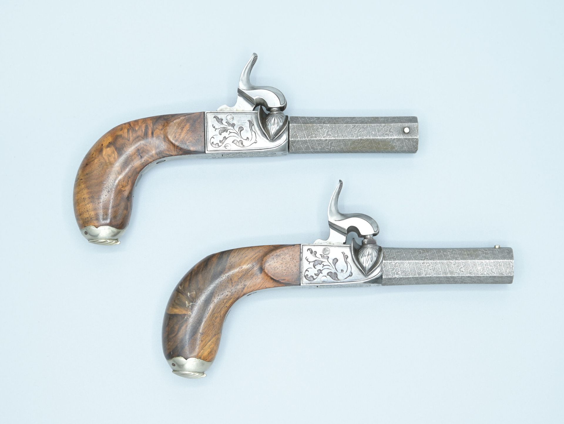 Null Pair of percussion and scotch pistols. Engraved lock of foliage and barrels&hellip;