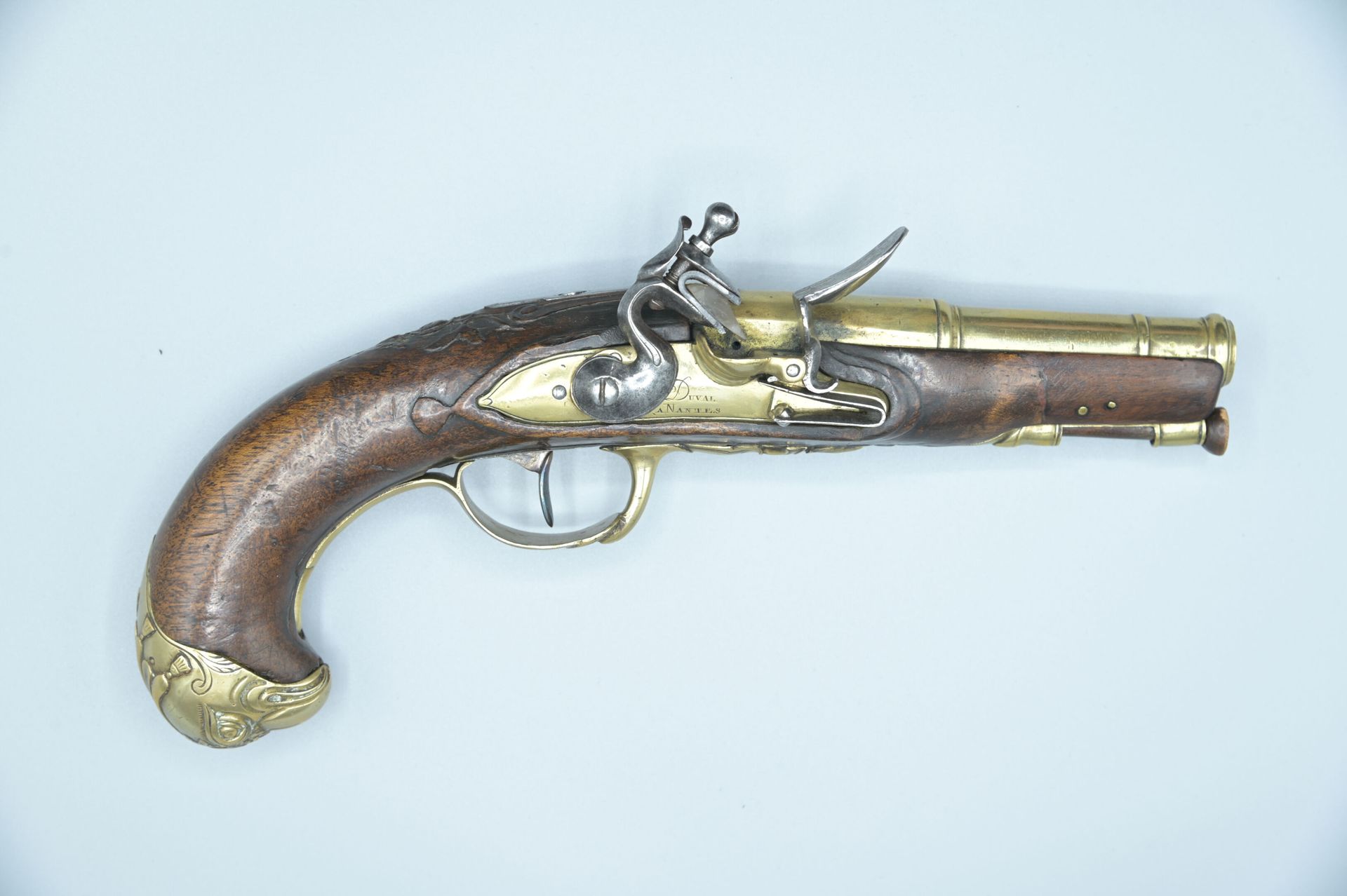Null Pistol of Marine. Round-bodied bronze and iron lock signed "DUAL à Nantes".&hellip;