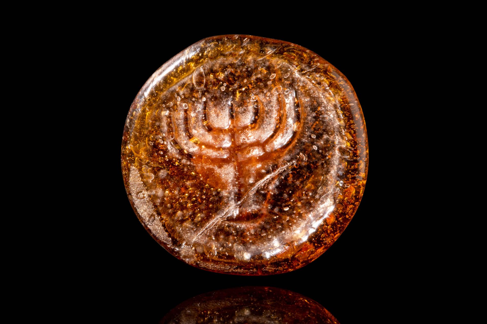 LATE ROMAN GLASS MENORAH STAMP Ca. AD 300 - 500.
A brown glass stamp from the La&hellip;