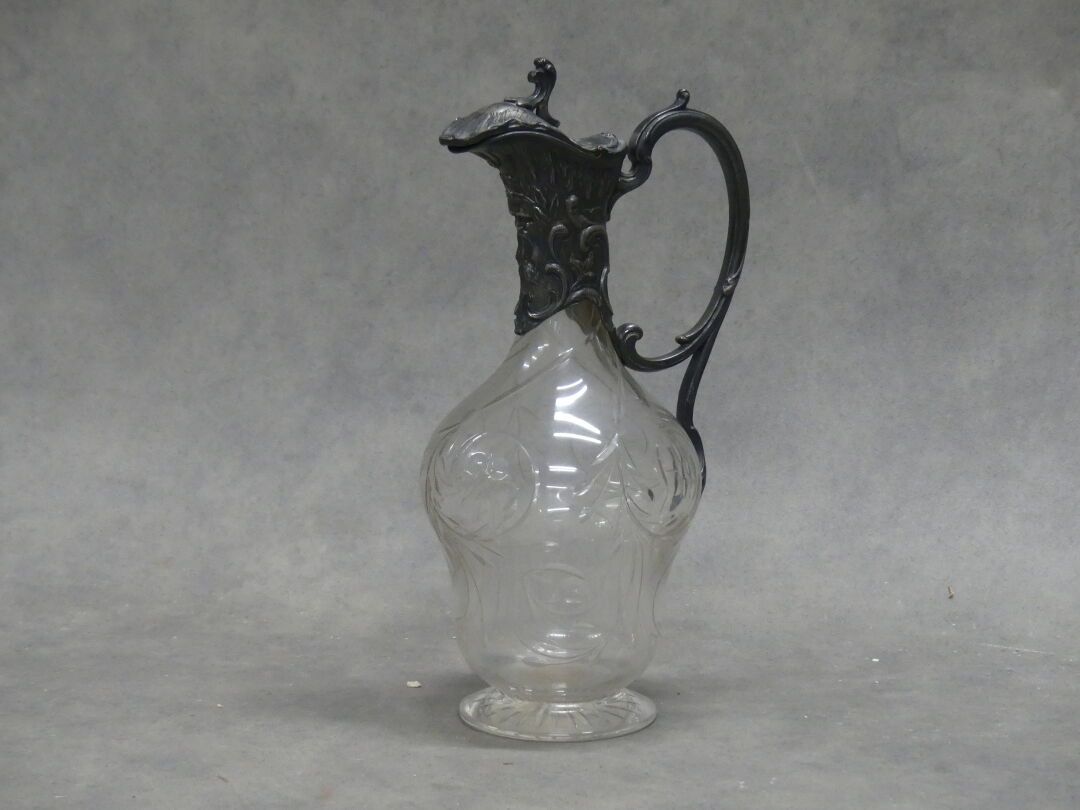 Null Glass ewer carved with flowers, silver frame with rocaille decoration. Loui&hellip;