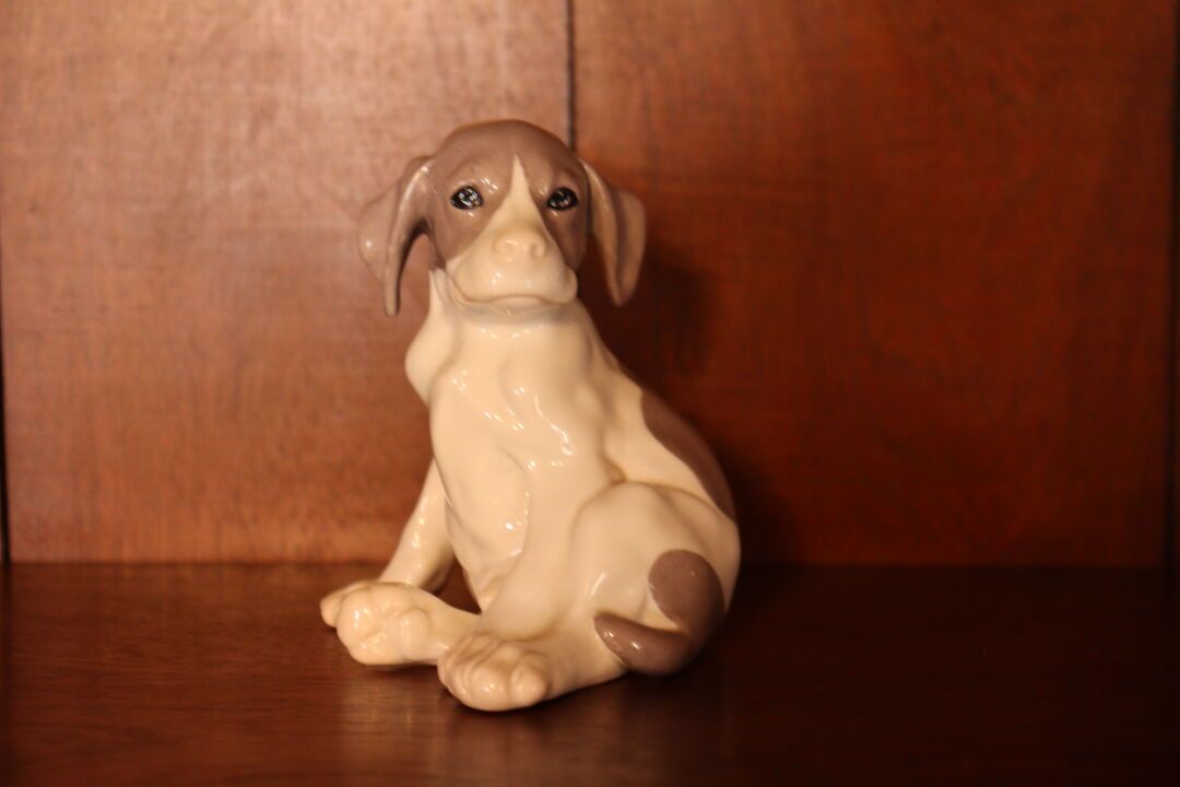 Null ROYAL COPENHAGEN. Puppy in polychrome porcelain, stamped on the bottom. Hei&hellip;