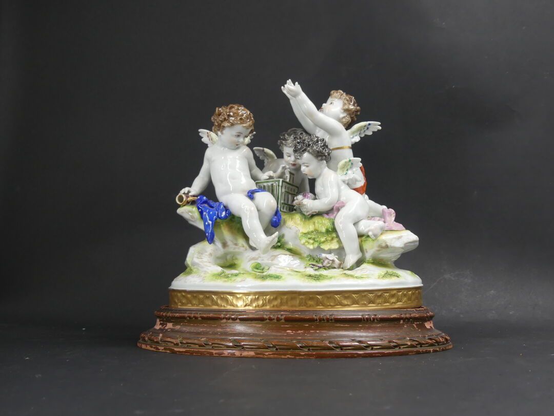 Null Subject in polychrome porcelain with cherubs. On a base. Bears a mark MR 17&hellip;