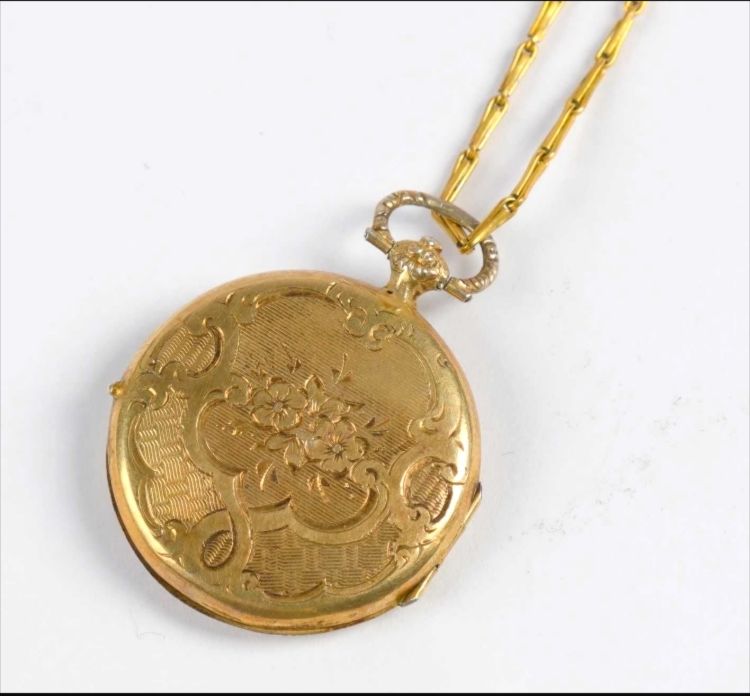 Null 18K(750°/°)金奖章，带刺桐叶装饰(accdt)，铰接式链接。重量：7克。