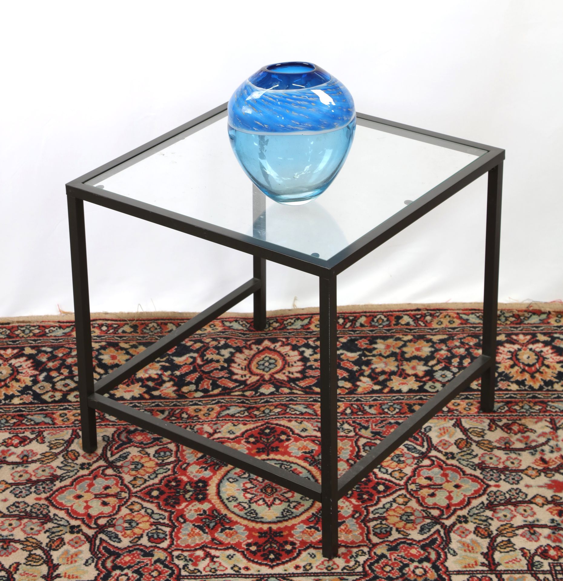 Null Sofa end table, black metal structure, glass top.
