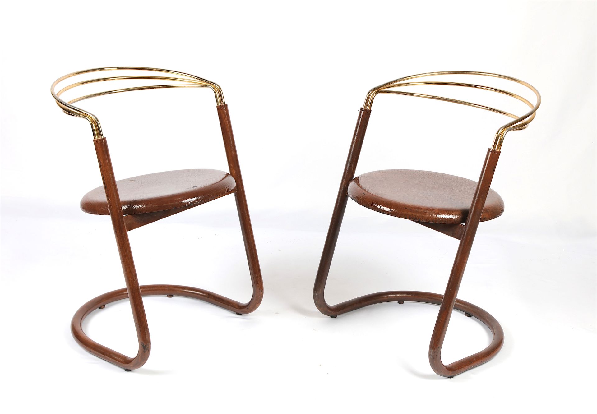 Null Pair of armchairs, curved gilded metal back, brown lacquered wood seat.