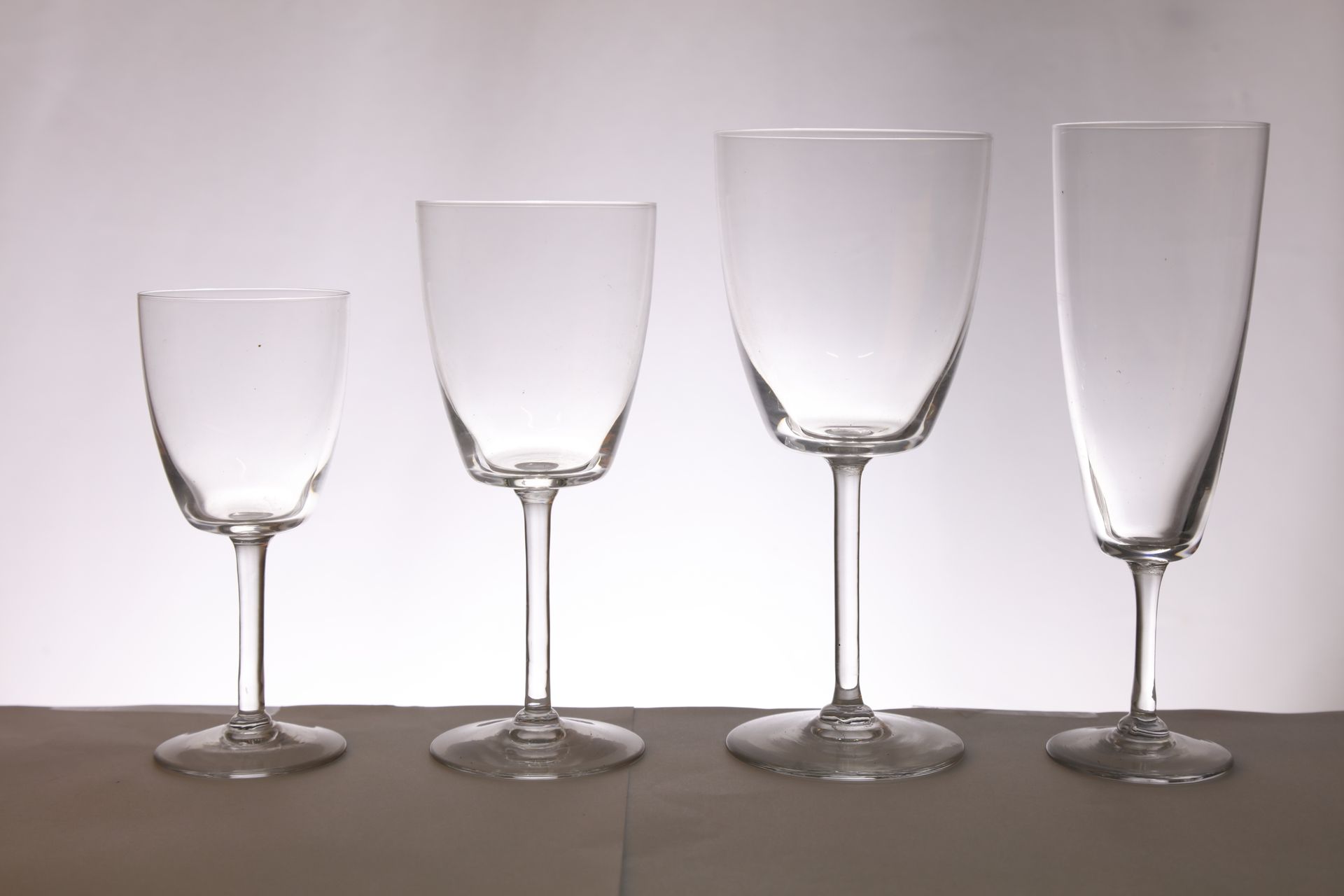 Null 
Set of glasses including: 11 champagne flutes, 9 wine glasses, 10 water gl&hellip;