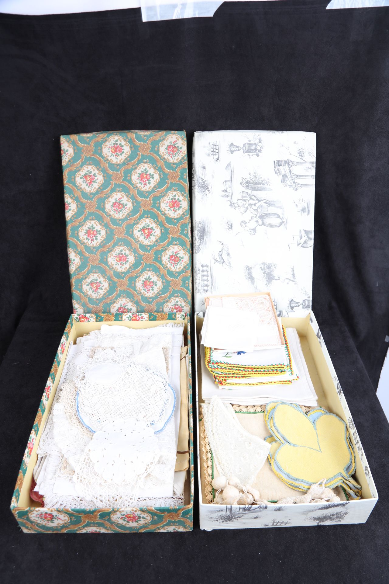 Null Two boxes of various doilies and handkerchiefs (good condition).
