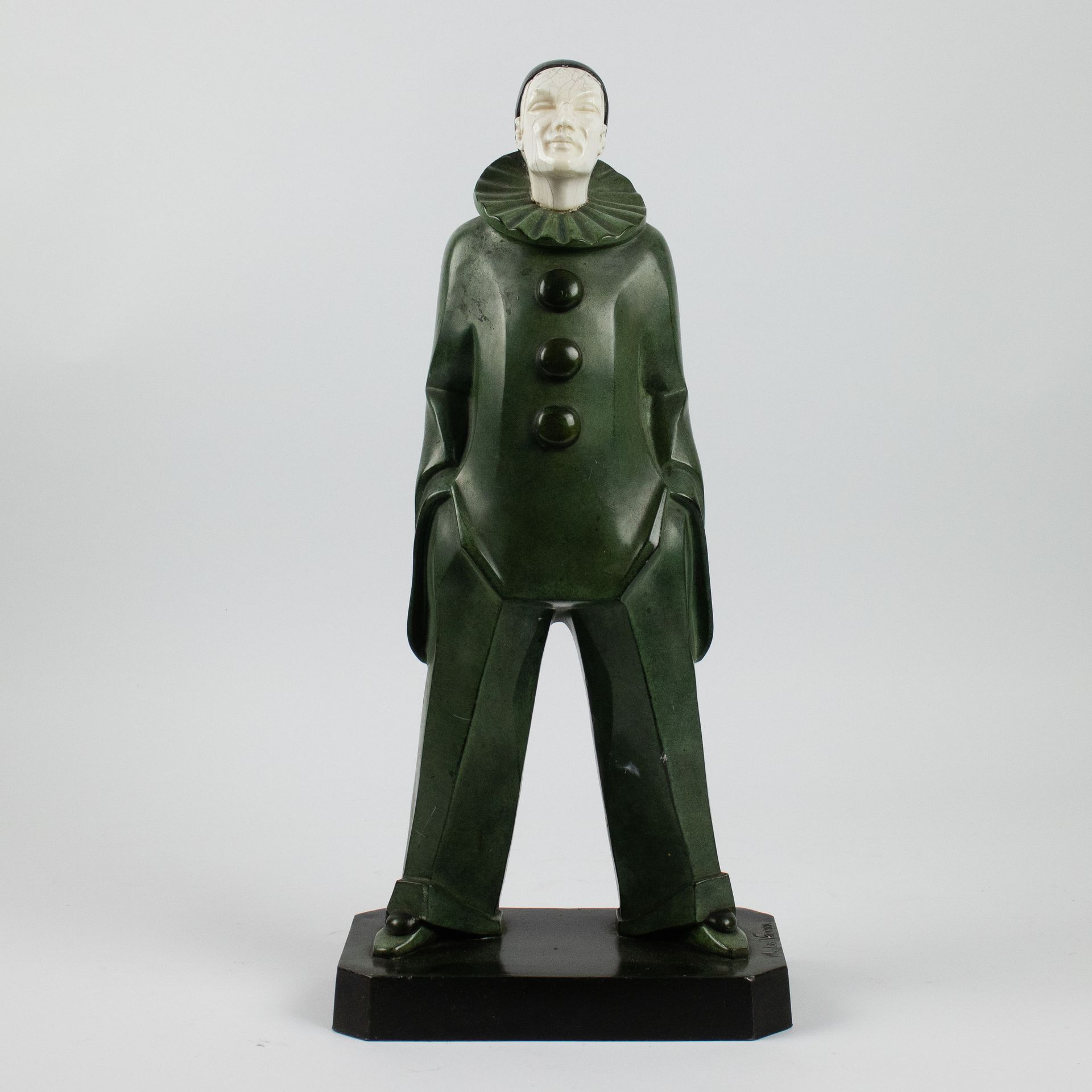 MAX LE VERRIER (1891-1973) 
A patinated metal Pierrot with ivory head, signed.

&hellip;