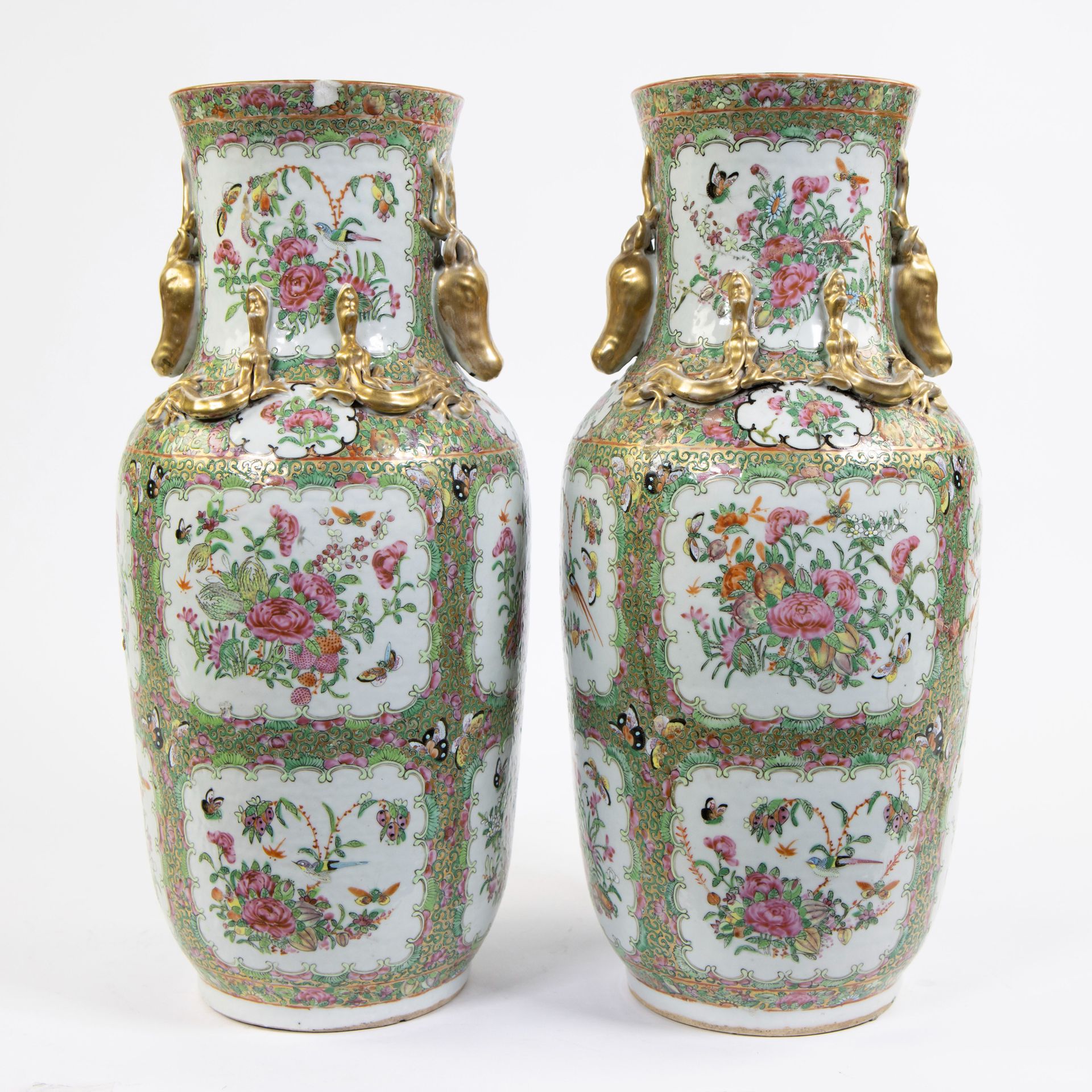 Null A pair of large Canton porcelain baluster vases, decorated in famille rose &hellip;