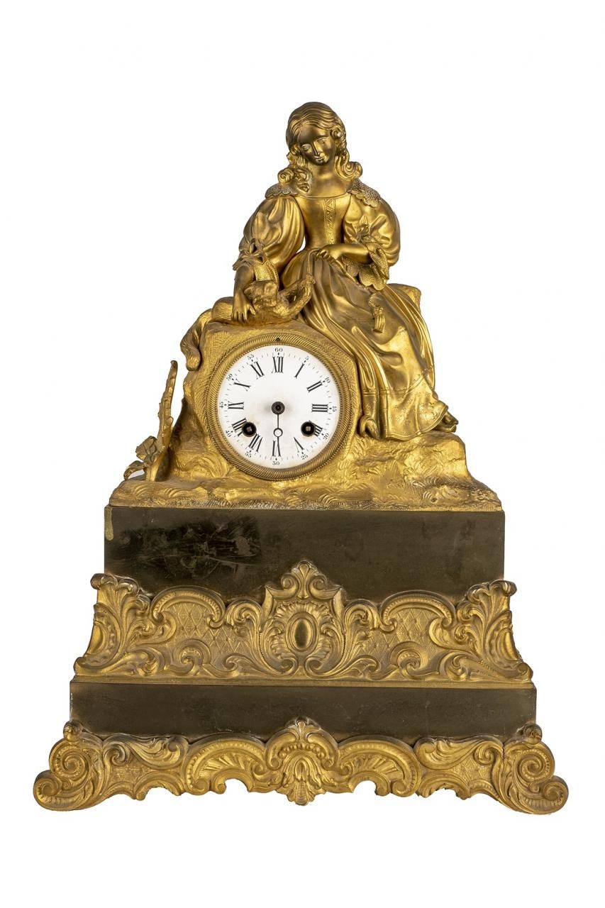 Null Pendule de table en bronze doré représentant une dame jouant avec un chat. &hellip;