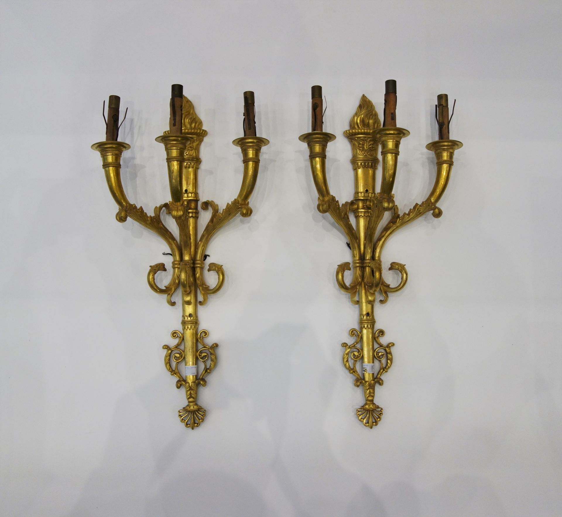 Null Pair of ormolu sconces with three arms of light formed by volutes, the shaf&hellip;