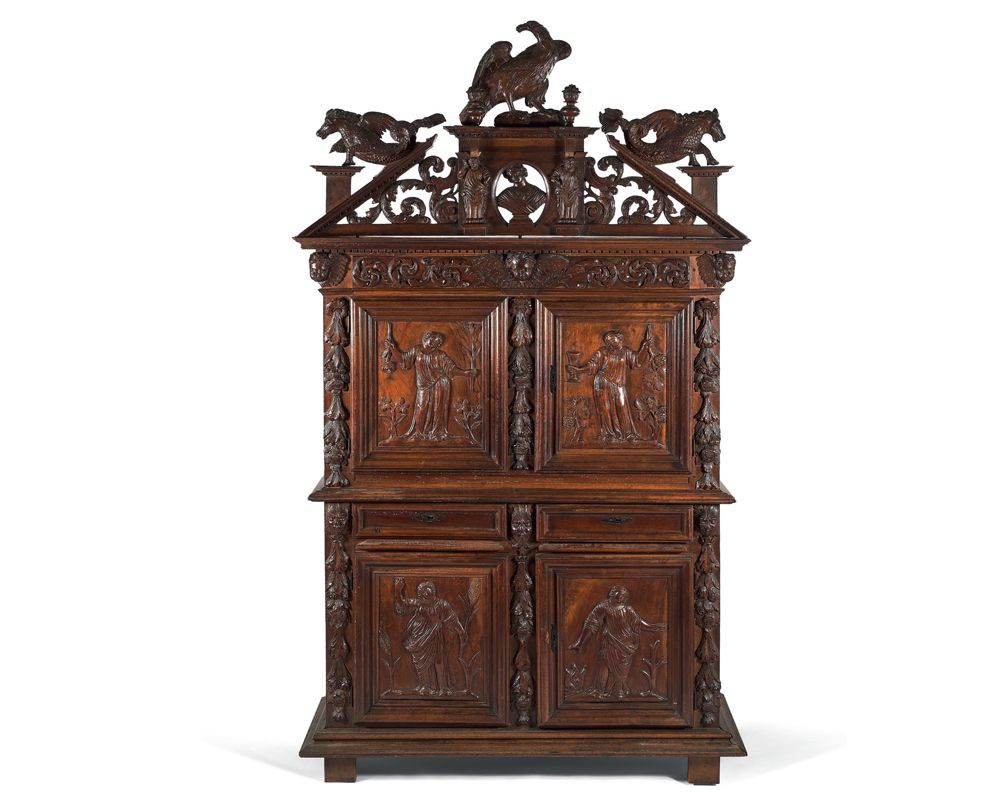 Null Carved walnut cabinet opening with four doors and two drawers.
Panels of th&hellip;