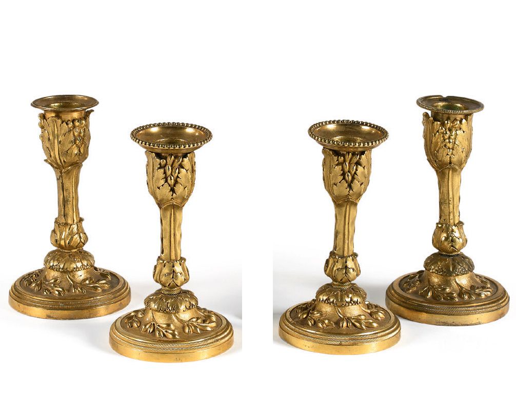 Null 四个球状的小烛台，用带凹槽和鎏金的青铜制成。
两个来自路易十六时期，另外两个来自路易十六风格。
高度：13.5厘米