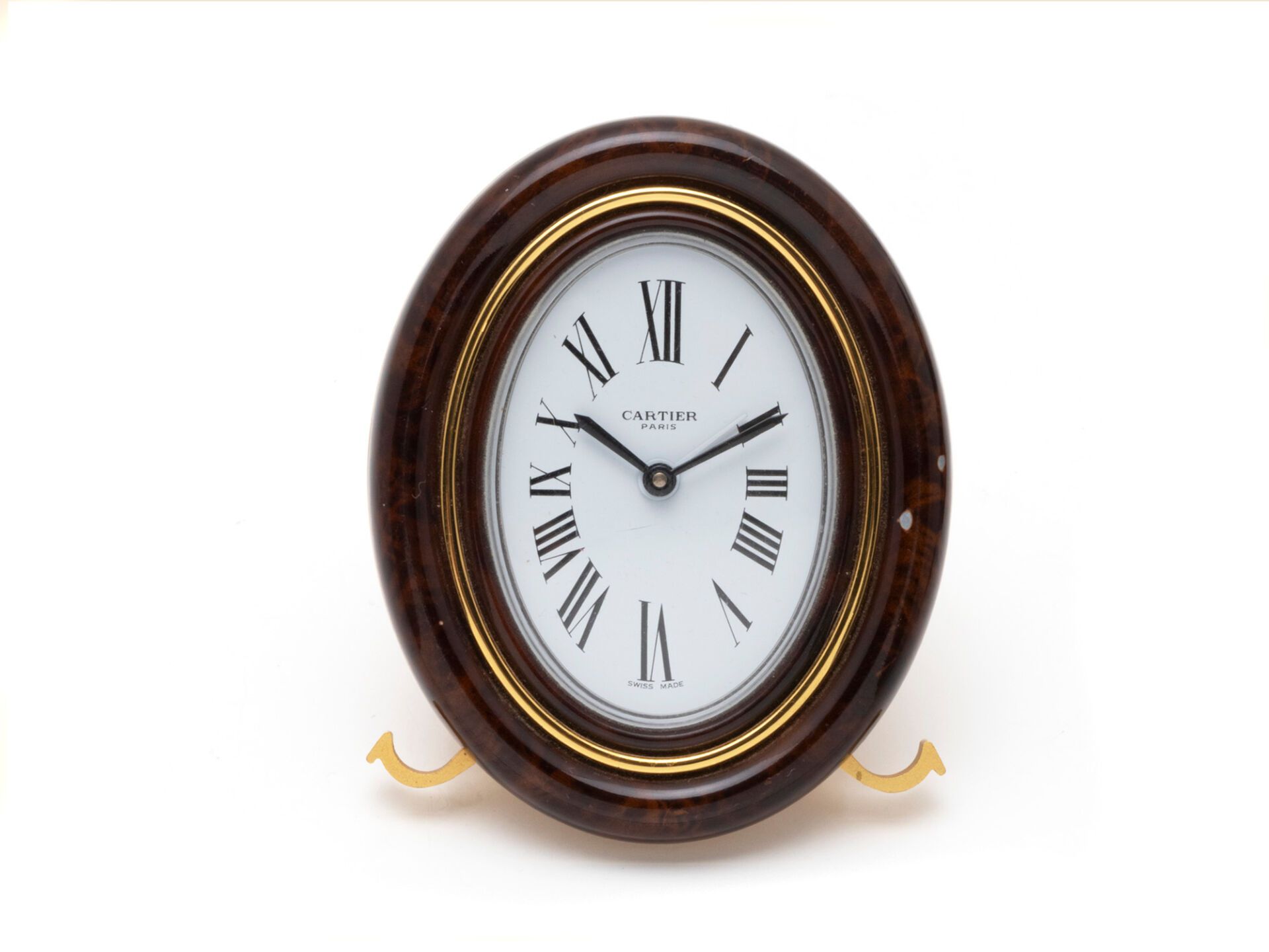 Null 卡地亚
Baignoire''闹钟，镀金金属和仿木漆面，白色表盘上绘有罗马数字。石英机芯。有签名和编号（原样，石英系统缺失）。
尺寸：9 x 7.3 &hellip;