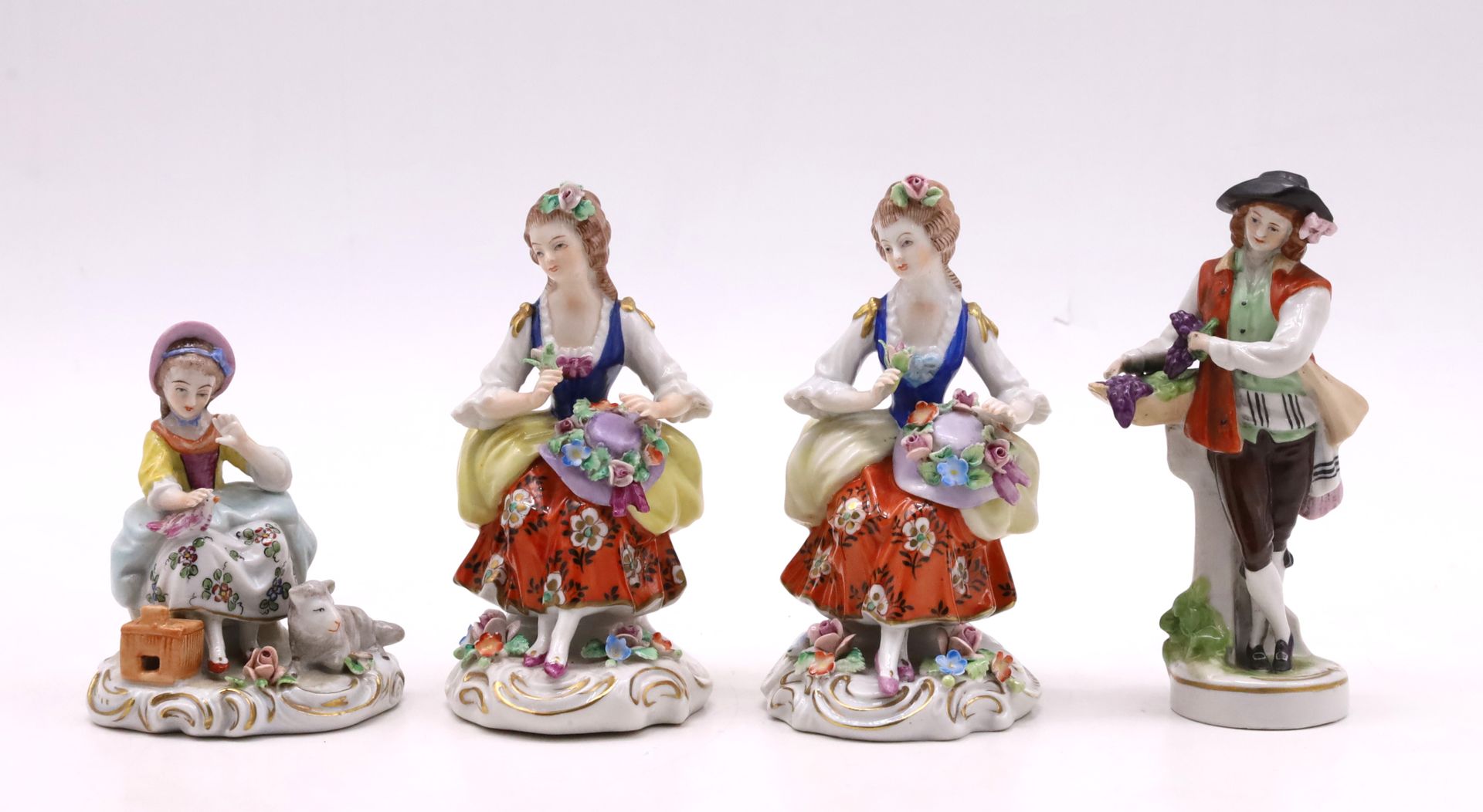 Null Suite of four polychrome porcelain figures: two women with hats (H. 10 cm),&hellip;