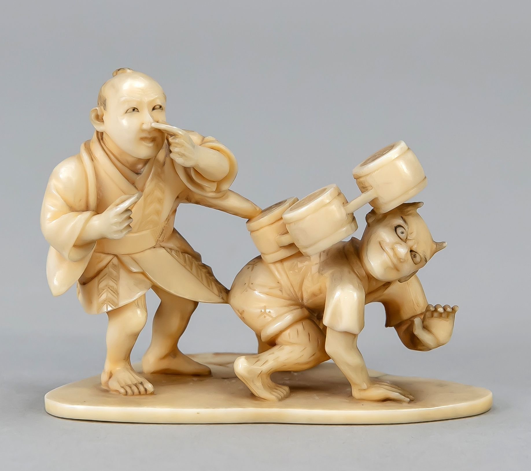 Null Okimono, Japan, late 19th century, ivory carving. Small humorous group of f&hellip;