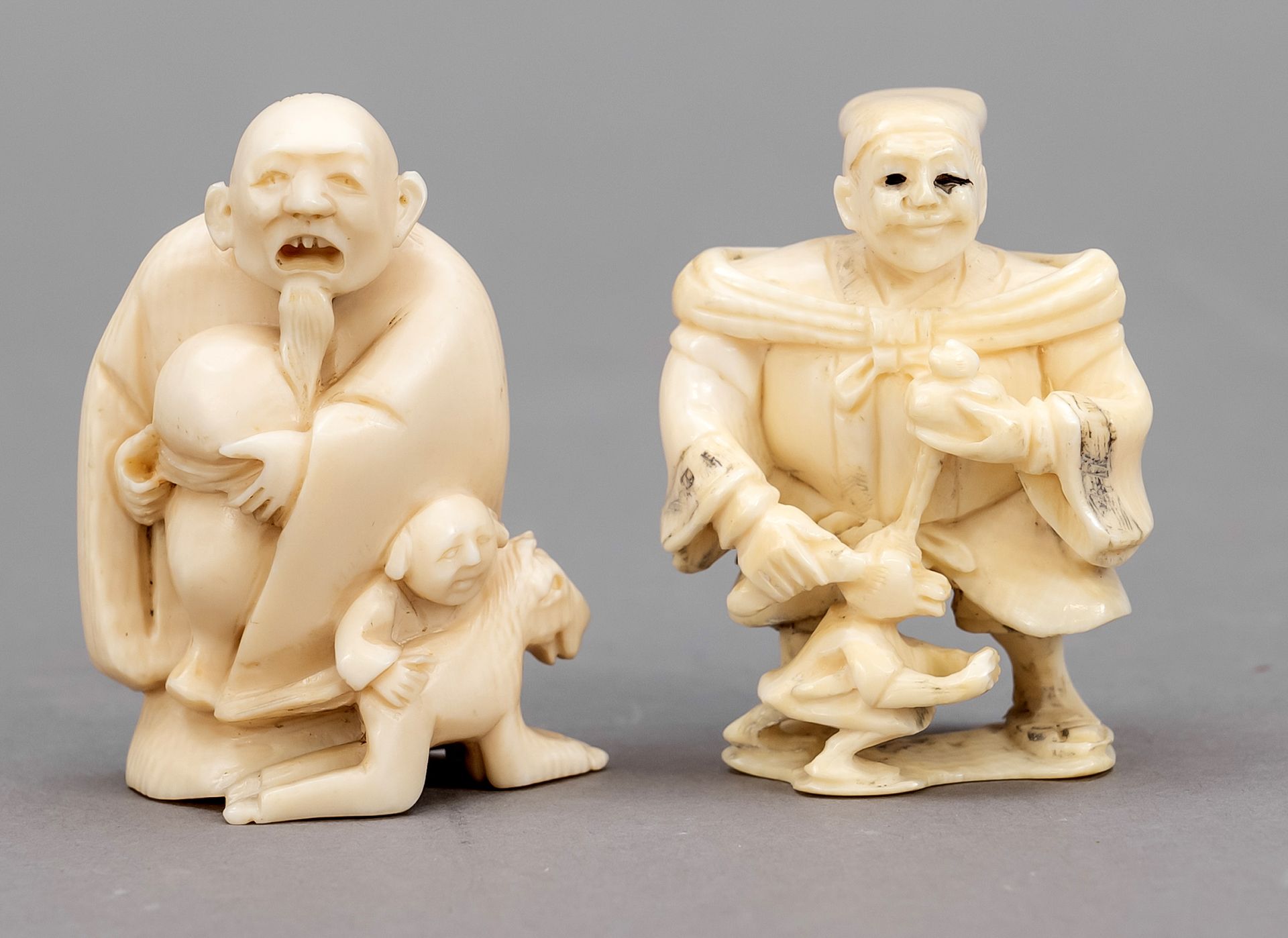 Null 2 Netsuke, Japan, end of 19th c., ivory. One under the feet, the other sign&hellip;