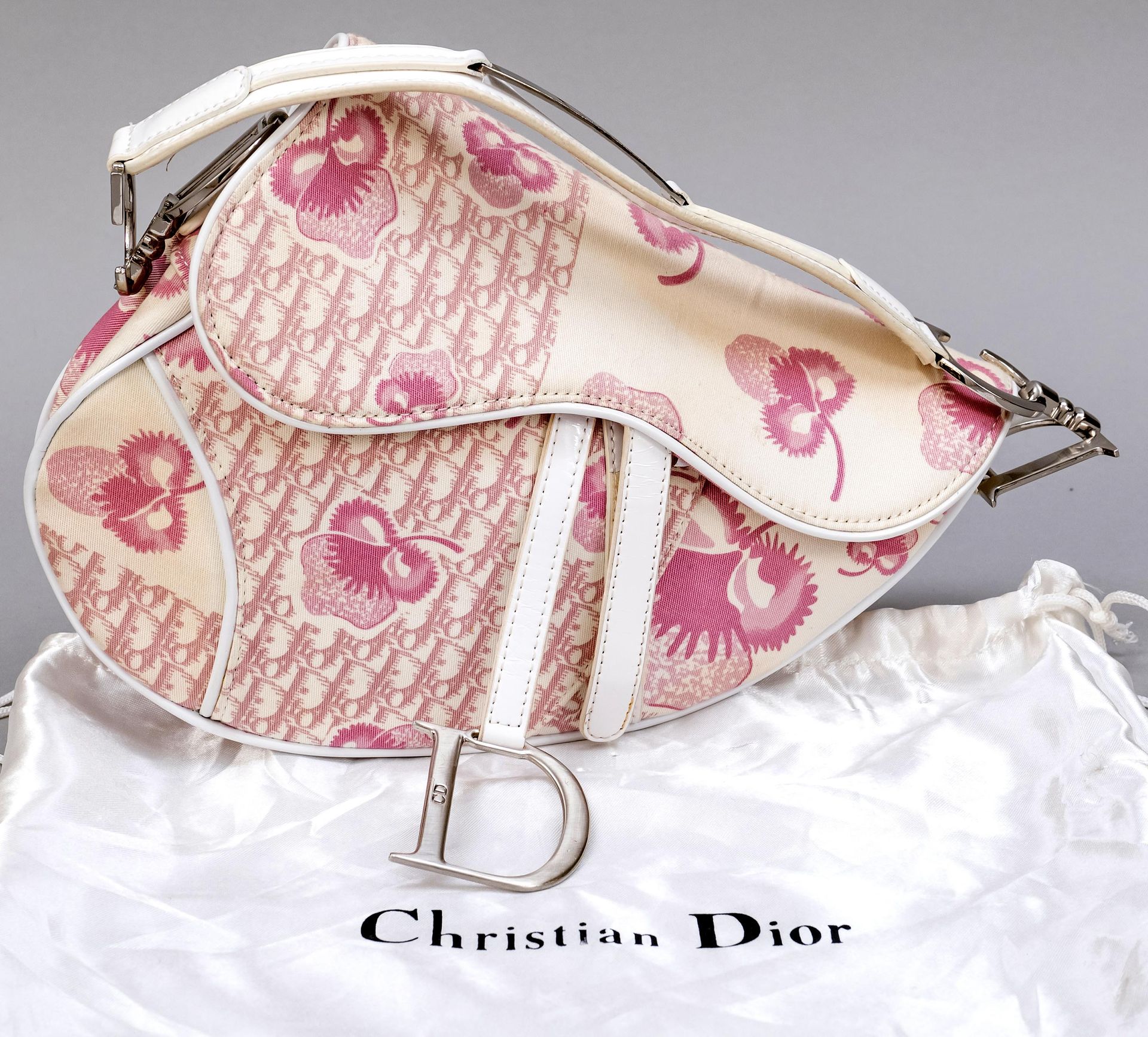 Null Dior, small vintage saddle bag, ivory fabric with logo and floral print in &hellip;