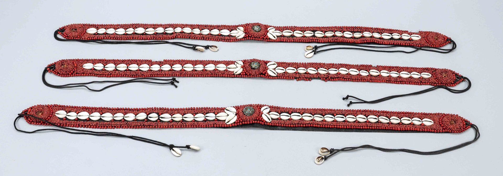 Null Three belts with beads and cowrie shells, Africa, belt embroidered with red&hellip;