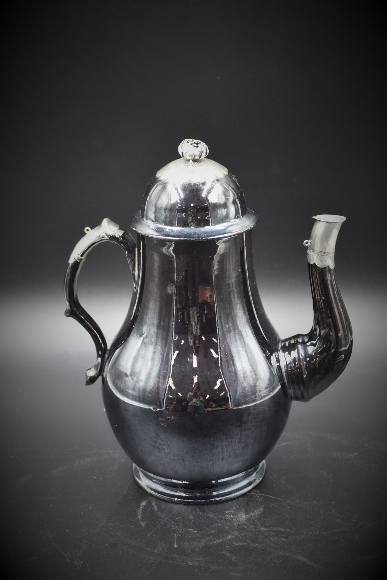 Null Coffee pot in Namur clay, silver frame. 18th century. Height : 29 cm.